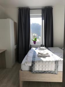 Posteľ alebo postele v izbe v ubytovaní Panorama Apartments