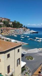 a view of a harbor with boats in the water at La casetta in piazza in Porto Santo Stefano