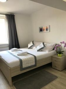 Posteľ alebo postele v izbe v ubytovaní Panorama Apartments