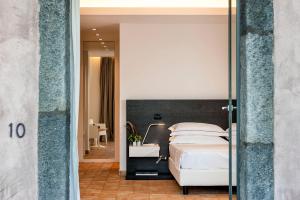 Postel nebo postele na pokoji v ubytování Ramo d'Aria Etna Boutique Hotel