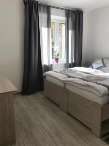 Posteľ alebo postele v izbe v ubytovaní Panorama Apartments