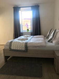 Posteľ alebo postele v izbe v ubytovaní Panorama Apartments