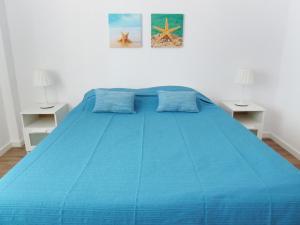 Postel nebo postele na pokoji v ubytování Ocean Breeze Apartment