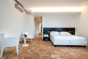 Postel nebo postele na pokoji v ubytování Ramo d'Aria Etna Boutique Hotel