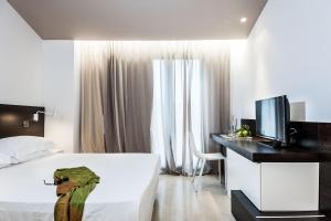 Postel nebo postele na pokoji v ubytování Ramo d'Aria Etna Boutique Hotel