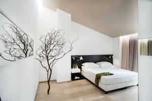 Postel nebo postele na pokoji v ubytování Ramo d'Aria Etna Boutique Hotel