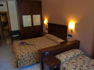 Cama o camas de una habitación en Hotel Turmo