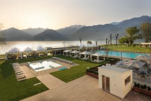 an aerial view of a resort with a body of water at Seven Park Hotel Lake Como - Adults Only in Colico