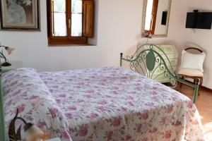 Säng eller sängar i ett rum på Antica Macina Toscana