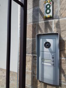 a pay phone on the side of a building at La Siesta in Villafranca di Verona