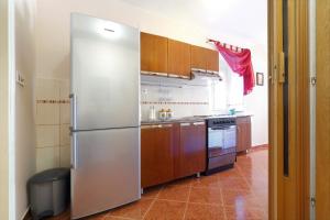 Kuchyň nebo kuchyňský kout v ubytování Apartment Meri