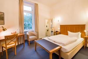 Postel nebo postele na pokoji v ubytování Hotel Brandies an der Messe