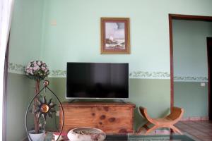 TV a/nebo společenská místnost v ubytování Casa Clotilde