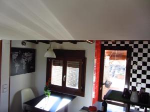 a kitchen with a table and a window in a room at La Plata in Toledo