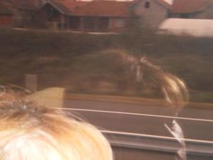 a blurry picture of a person looking out a train window at Zavrakli in Agia Paraskevi