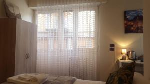 Posteľ alebo postele v izbe v ubytovaní Dreaming Piazza Bra Rooms