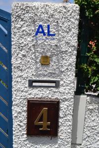 a sign on a building with a number four at Holiday House 4 You in Funchal