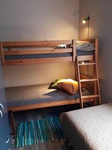 a couple of bunk beds in a room at Chelsea Karusselli 3 Apartment in Pärnu
