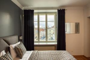 A bed or beds in a room at Tallinn City Apartments - Old Town