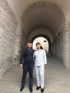 two men are standing in a tunnel at Hotel Brace in Gjirokastër