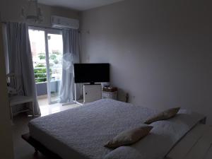 Un pat sau paturi într-o cameră la Altos del Sur