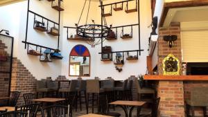 a restaurant with tables and chairs in a room at Patio Hotel in Antalya