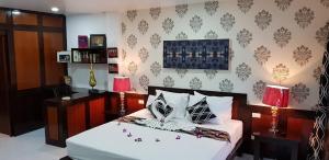 Letto o letti in una camera di Fong Kaew and Baan Nang Fa Guesthouse