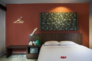 Postel nebo postele na pokoji v ubytování Praja Hotel