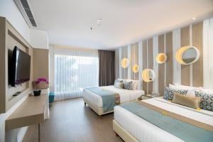 Postel nebo postele na pokoji v ubytování Grand Mirage Resort & Thalasso Bali - All Inclusive