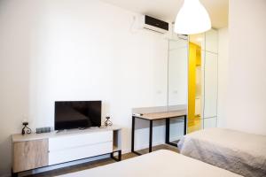Katil atau katil-katil dalam bilik di Meidan Suites