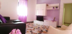 A television and/or entertainment centre at Appartamento Lorenzo Noto