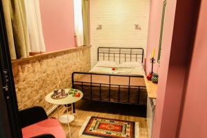 Postelja oz. postelje v sobi nastanitve MGA Hostel & Tours