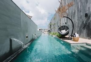 Bazén v ubytování Lloyd's Inn Bali nebo v jeho okolí