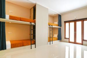 Postel nebo postele na pokoji v ubytování Taste of Bali Hostel