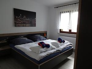 מיטה או מיטות בחדר ב-Ferienhaus Lagenhof
