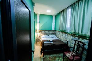 Postelja oz. postelje v sobi nastanitve MGA Hostel & Tours