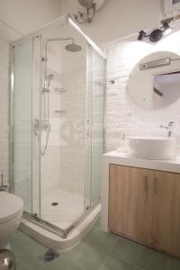 a bathroom with a shower and a sink at S&G Corfu Old Town Apartments in Corfu