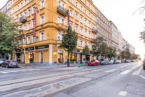 a city street filled with lots of tall buildings at La Fenice in Prague