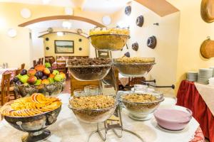a table topped with bowls of food on a table at La Fenice in Prague
