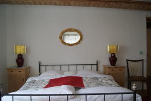 En eller flere senge i et værelse på Zweite Heimat Privatpension