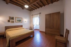 Rúm í herbergi á Torre nel Chianti