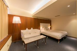 Postel nebo postele na pokoji v ubytování Hotel Landmark Wakayama