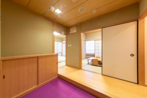 Postel nebo postele na pokoji v ubytování Hotel Landmark Wakayama