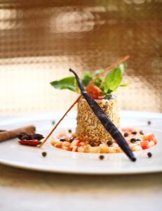 a plate of food with vegetables on top of it at The Residence Zanzibar in Kizimkazi