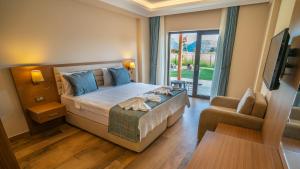 Postel nebo postele na pokoji v ubytování Dalyan Live Spa Hotel + 37 fotografií