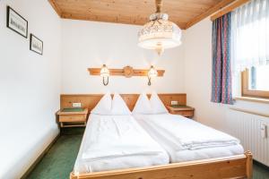 Postel nebo postele na pokoji v ubytování Haus am Platz - Weitgasser