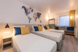 Postel nebo postele na pokoji v ubytování Tulip Inn Antwerpen + 37 fotografií