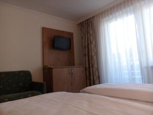 Łóżko lub łóżka w pokoju w obiekcie Hotel Wagner