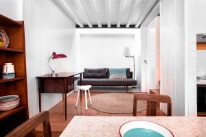 a living room with a couch and a table at Patio São Vicente in Lisbon