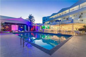 a swimming pool in front of a hotel at Hotel El Dorado in San Andrés